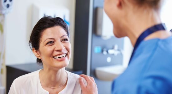 Female,Patient,Being,Reassured,By,Doctor,In,Hospital,Room